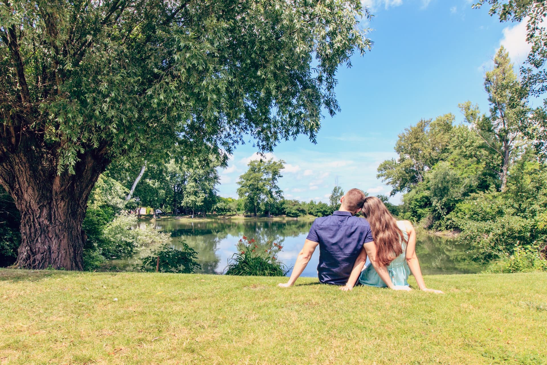 people at a park with a lake